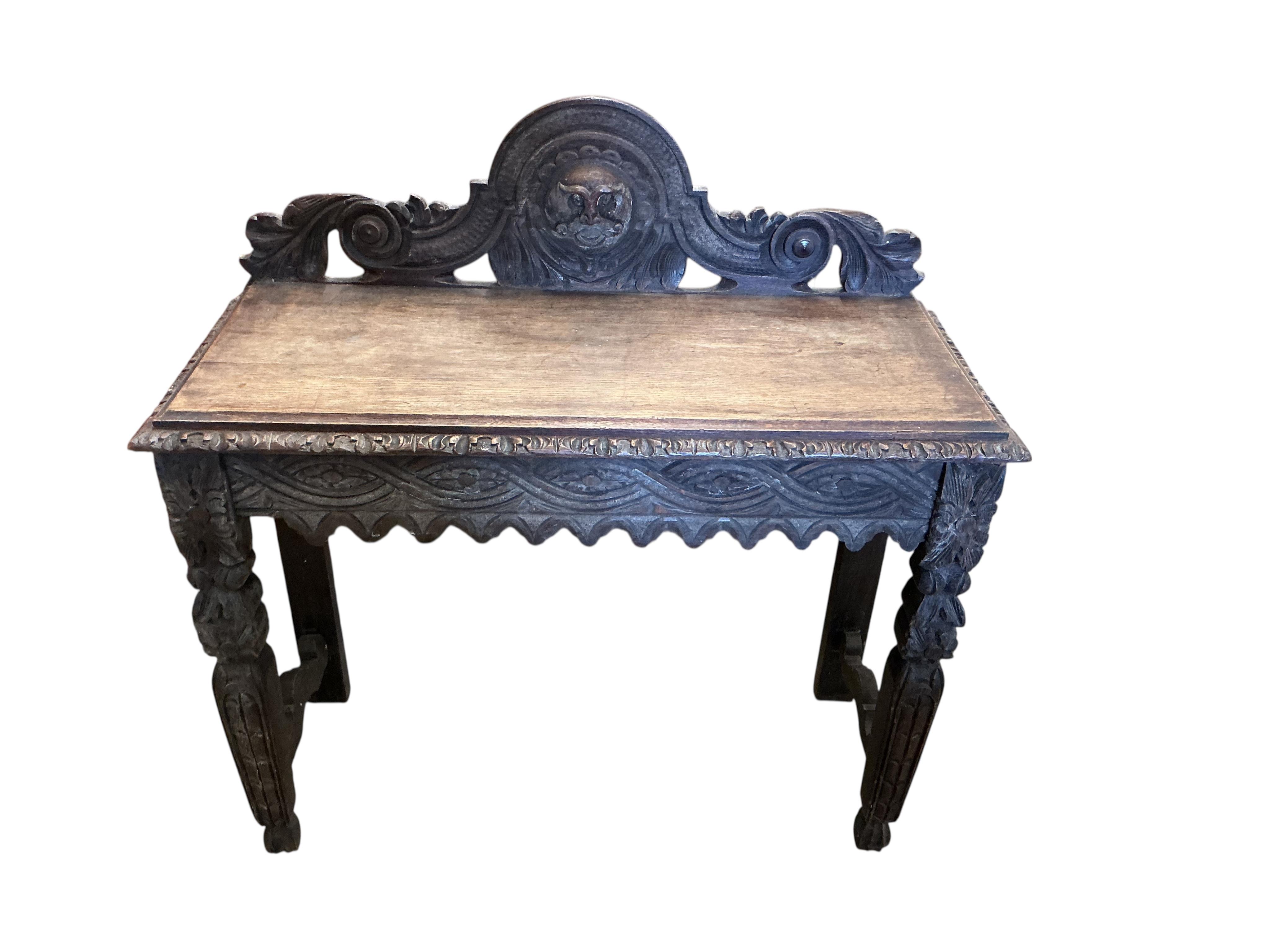 A Victorian carved oak hall table, width 103cm, depth 44cm, height 104cm